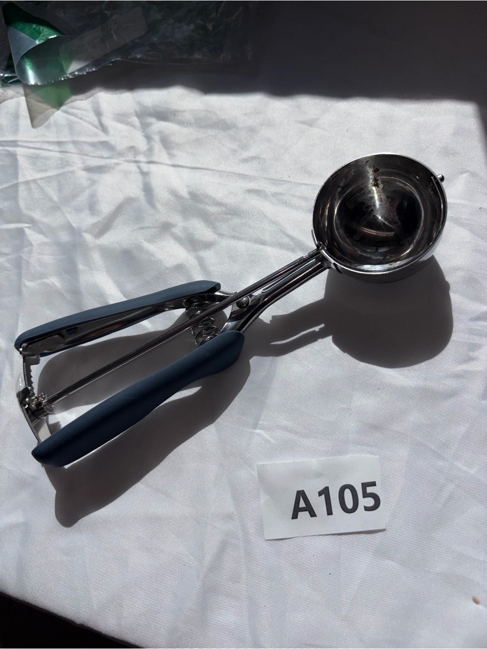 Blue handled ice cream scoop